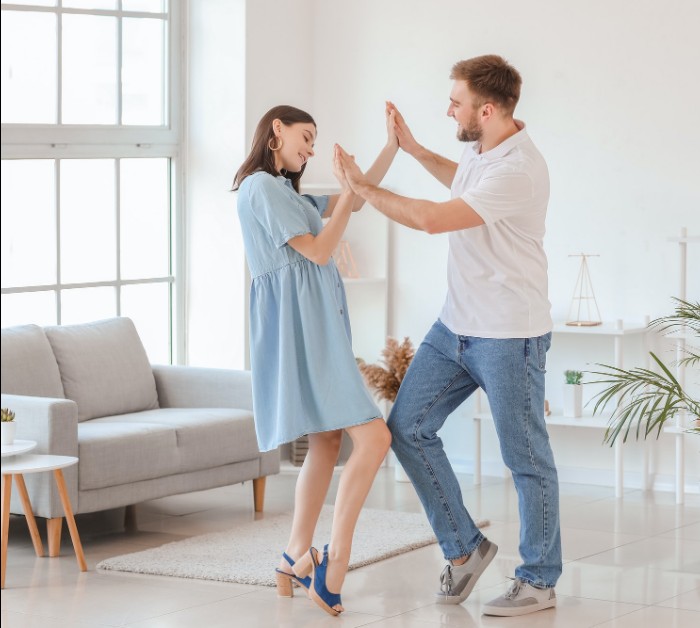 Couple dancing at home